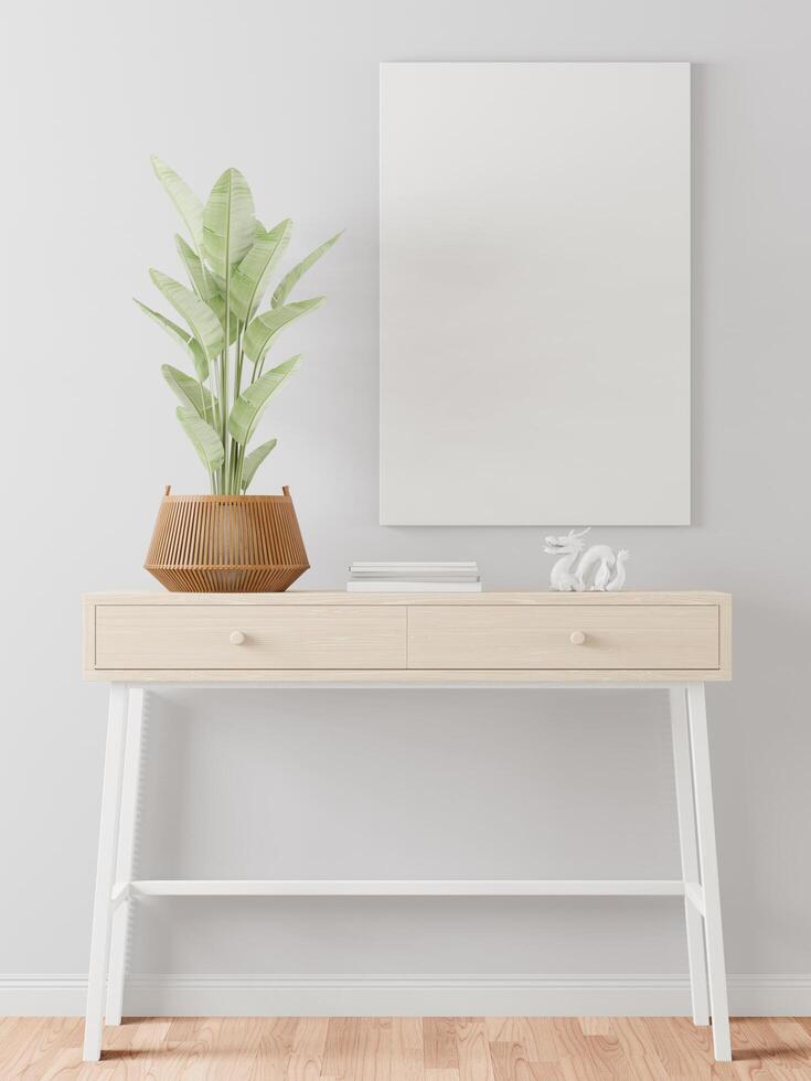 The living room is decorated with a storage table, picture frames and small plant pots. photo