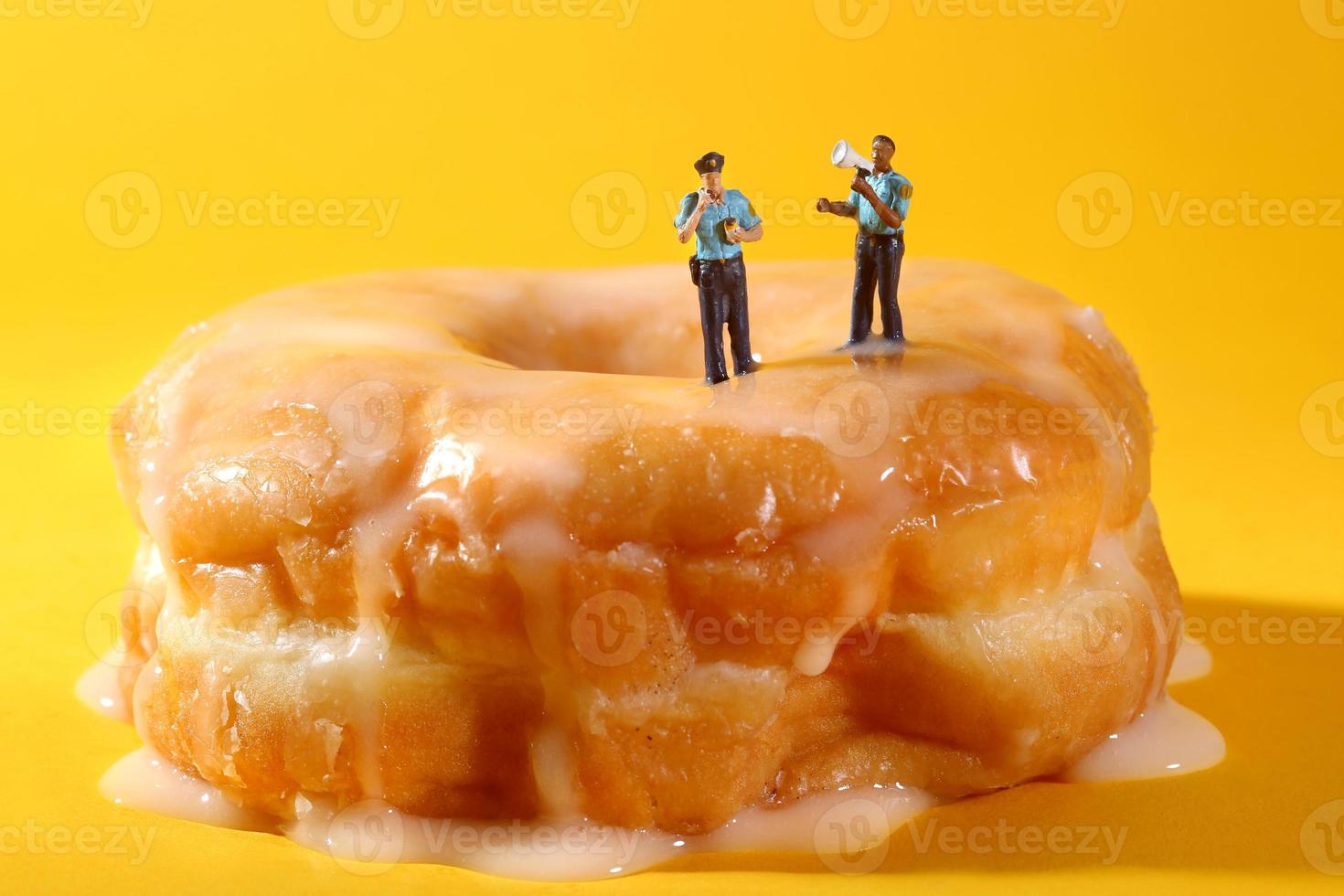 Police Officers in Conceptual Food Imagery With Doughnuts photo