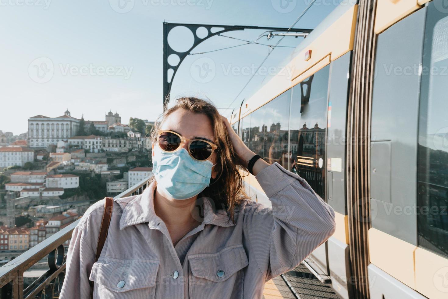 Young woman using sunglasses smiling a lot while touching them, sunglasses concept, summer and travel,copy space photo