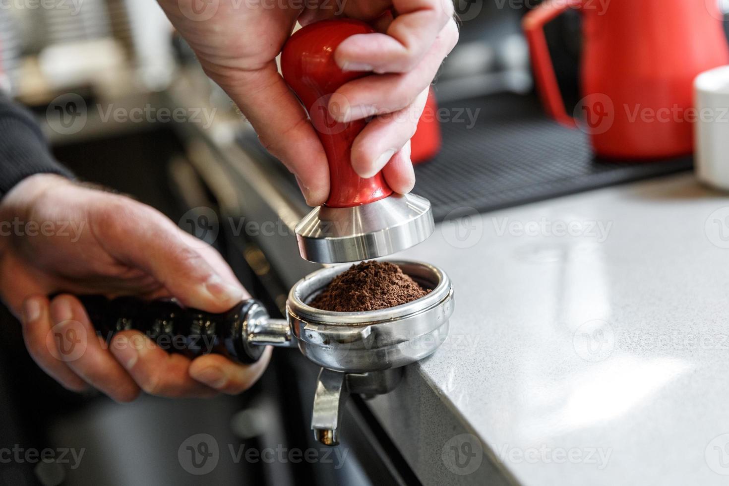 Bartender is about to temper coffee photo