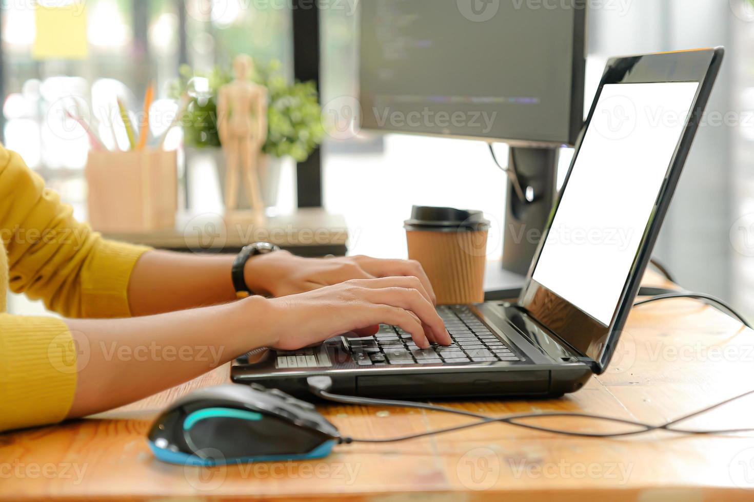 Programmers are using laptop to write programs according to customers' orders. photo