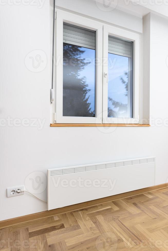 Smart heater convector. Smart Home with the smart heating system. Electric panel heating concept. photo