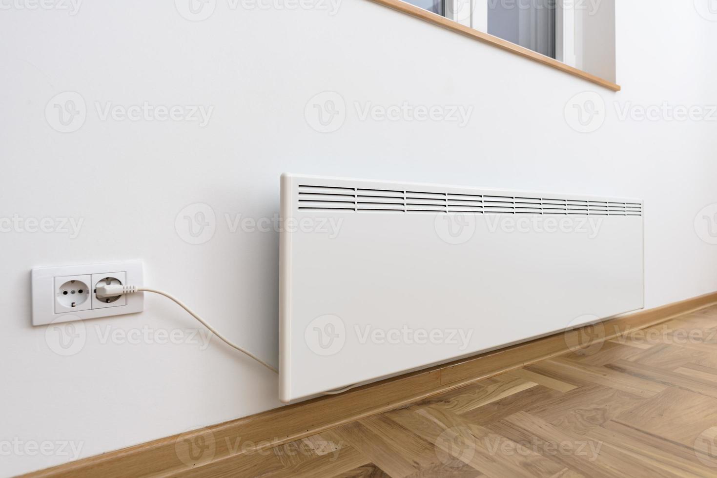 Smart heater convector. Smart Home with the smart heating system. Electric panel heating concept. photo