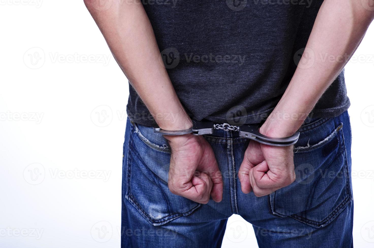 Close up of handcuffed hands photo