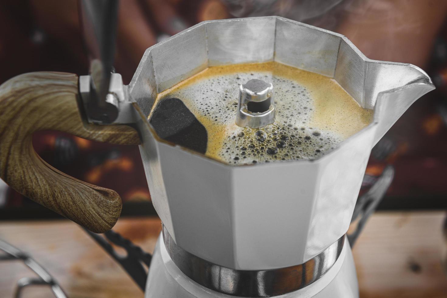 Coffee making with Moka pot and snack. photo