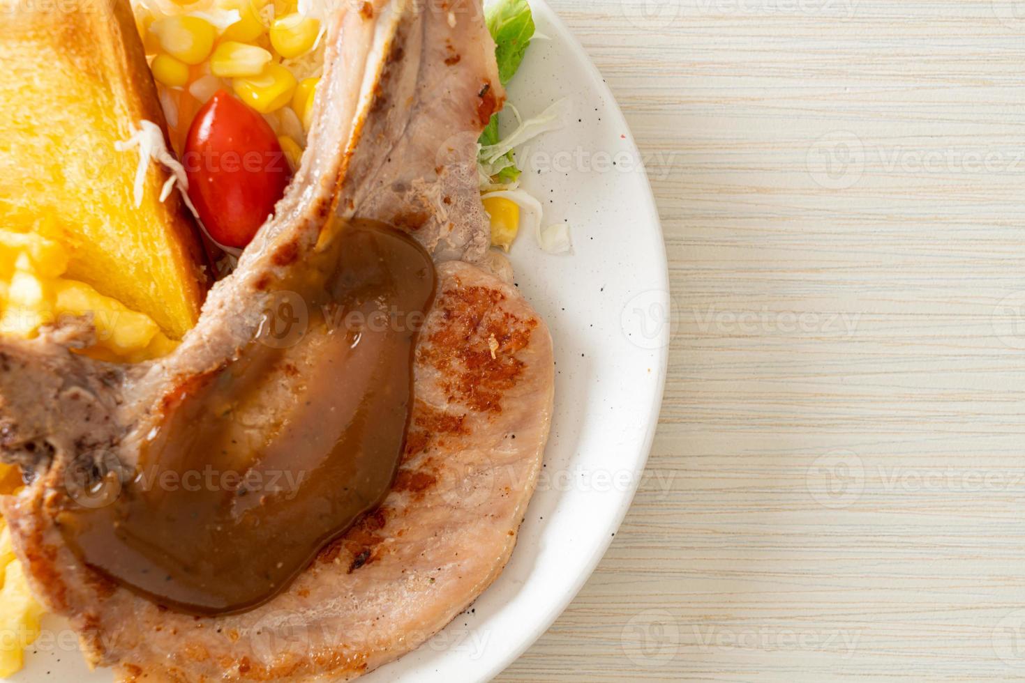 pork chop steak with chips and mini salad photo