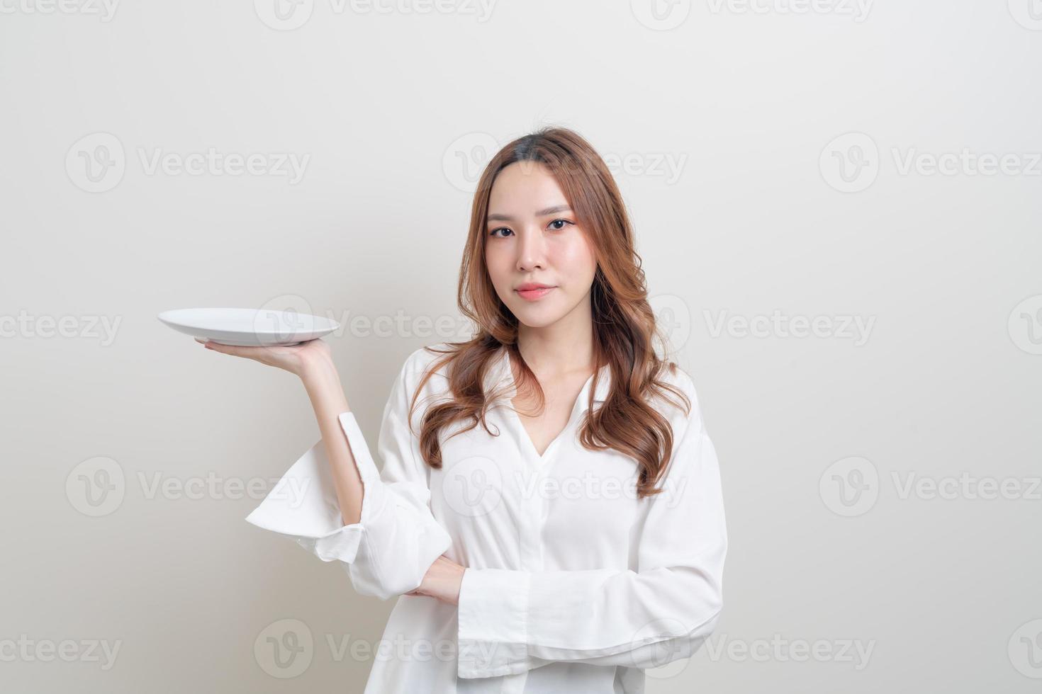 portrait beautiful Asian woman holding empty plate photo