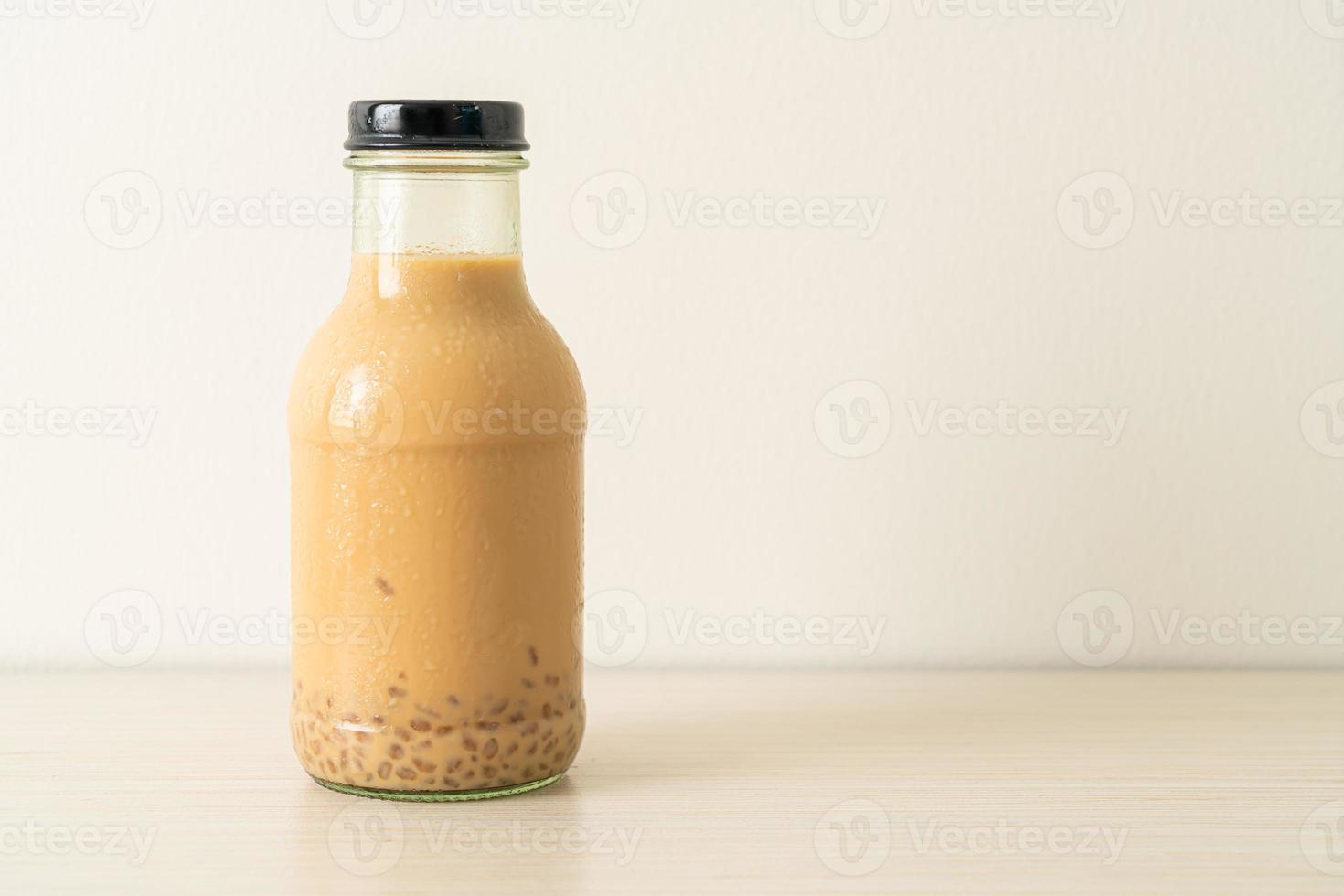 milk tea with pudding jelly in glass bottle photo