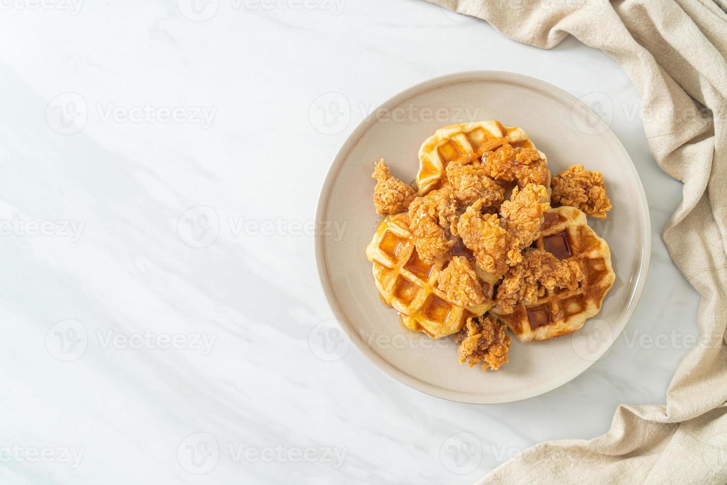 fried chicken waffle with honey or maple syrup photo