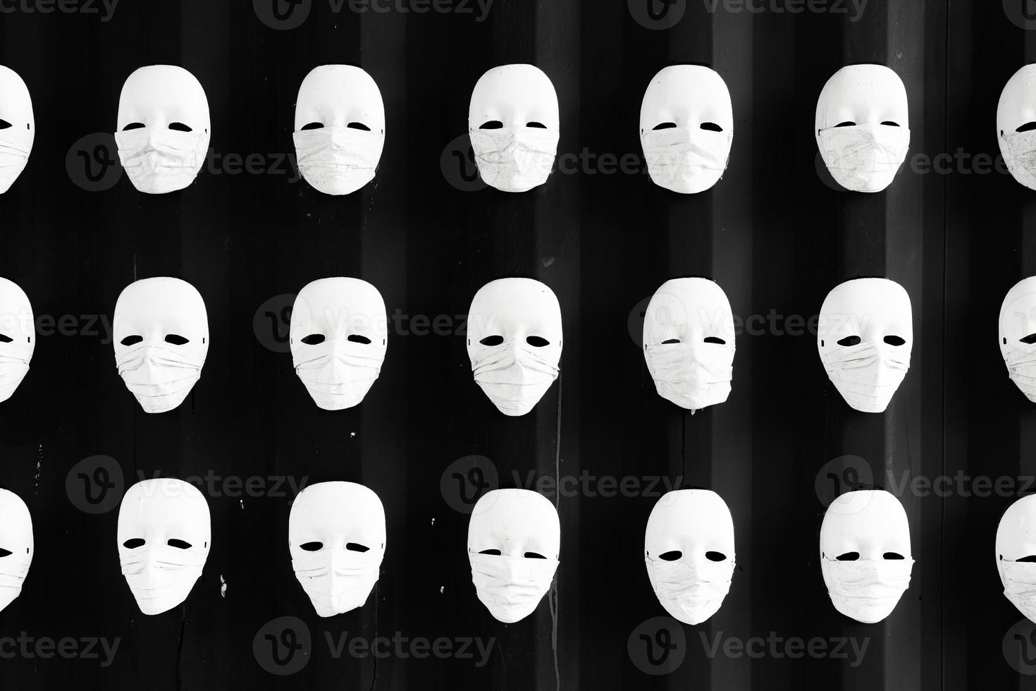 mask wearing surgical mask with black wall photo