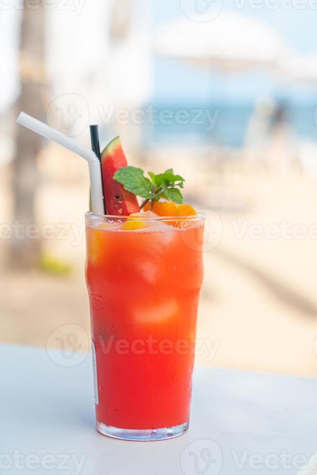 fruit punch with sea beach background photo