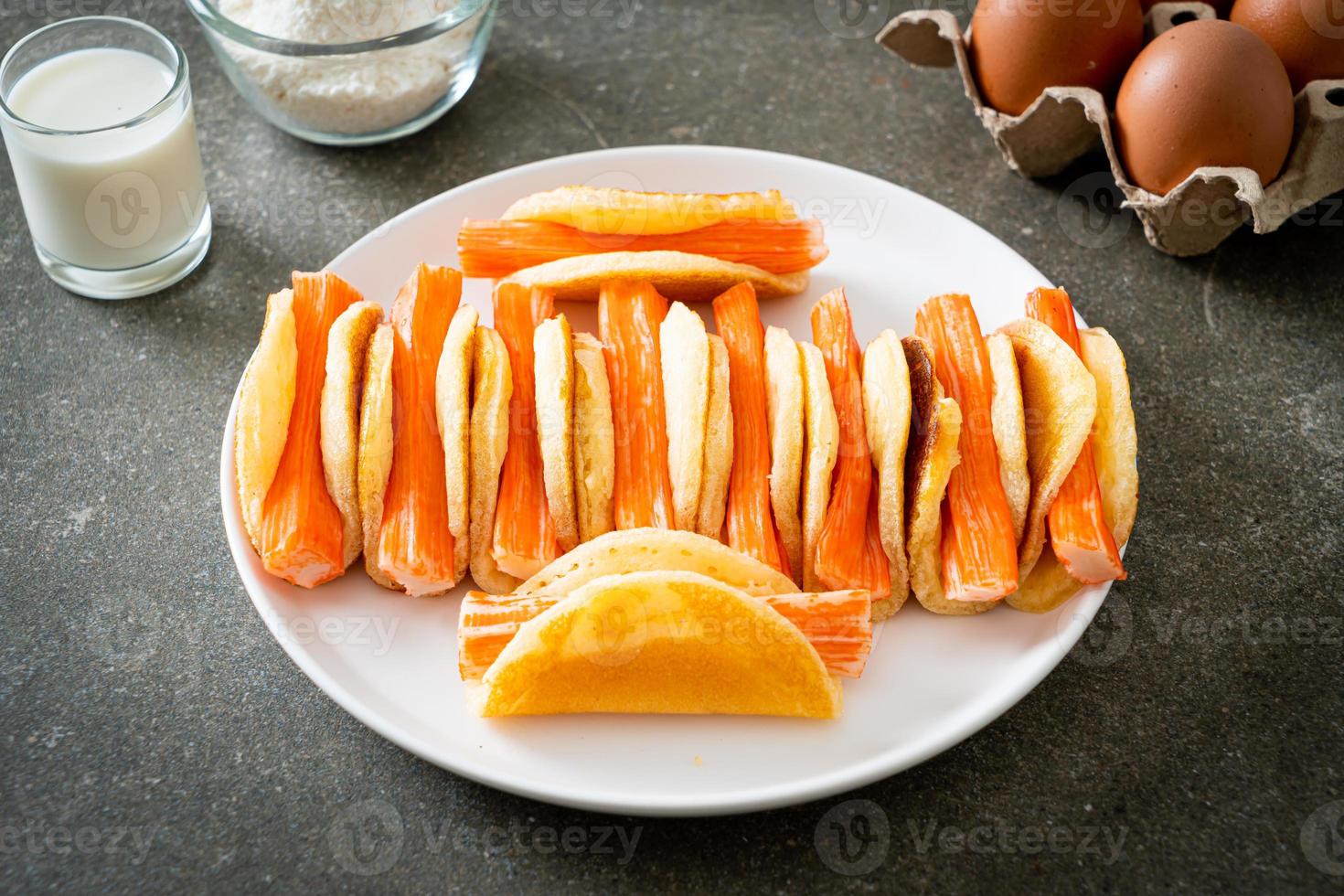 flat pancake roll with crab stick photo