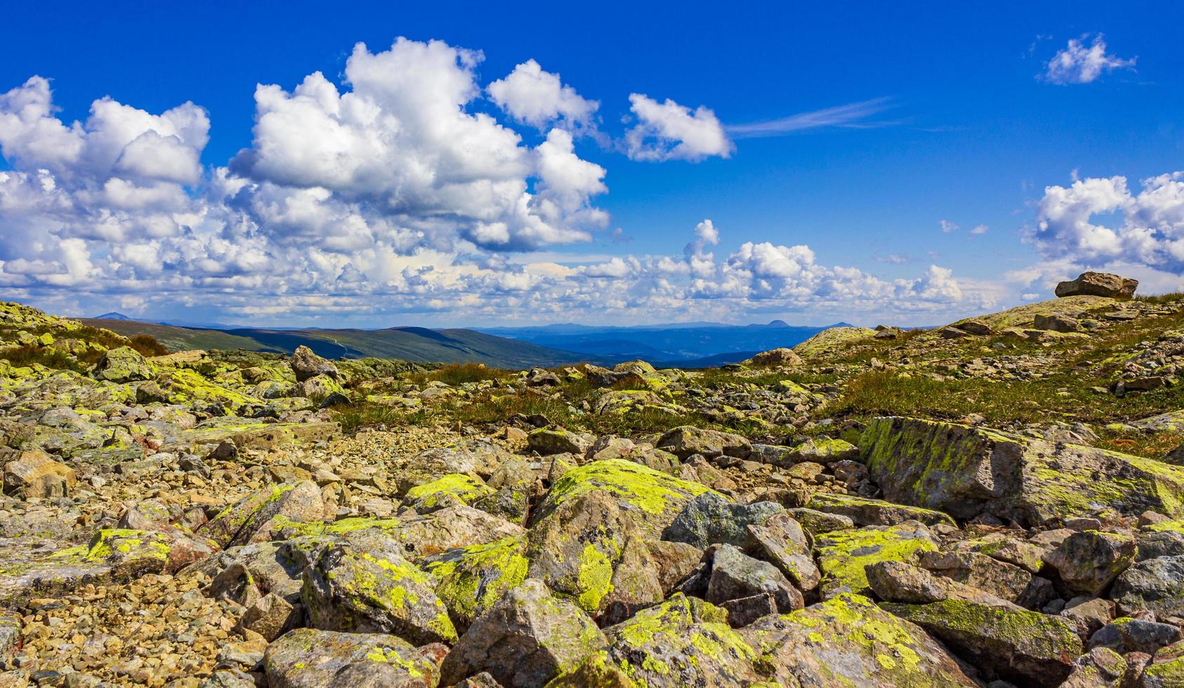 Amazing Norway norwegian landscape boulders at summit top of mountain photo
