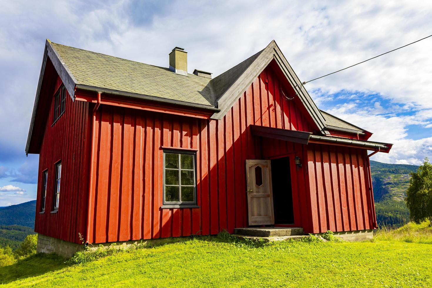 Red wooden cabin hut in Vang i Valdres, Norway photo