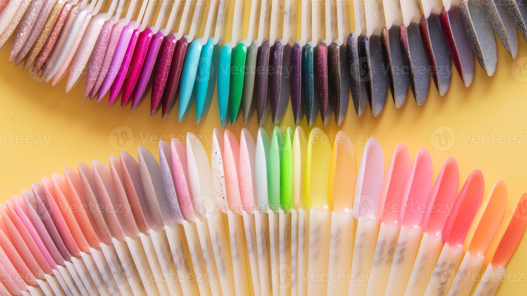 Tools for manicure flat lay on a colored background. Covering nails with gel polish concept photo