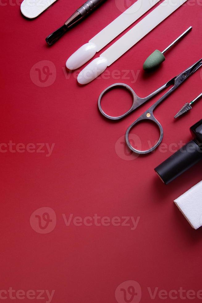 Manicure tools and tips on a colored background with copy space photo