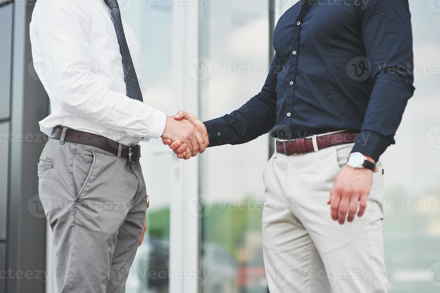 Handshake of two men. Successful business contacts after a good deal photo