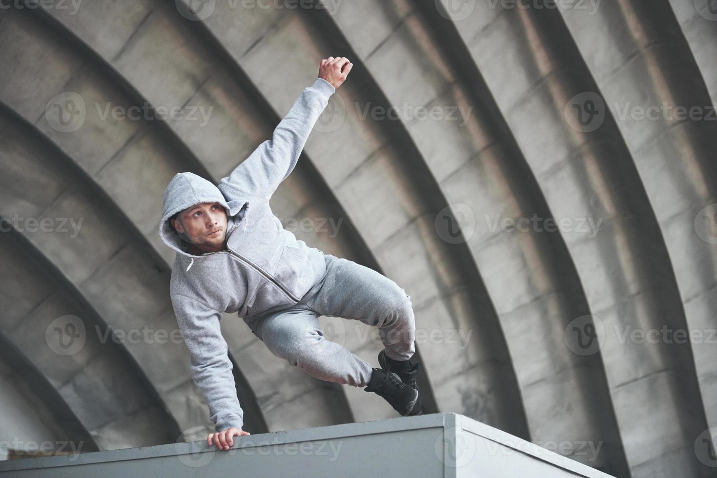 The guy in the park in the open air practices parks, high adrenaline. photo