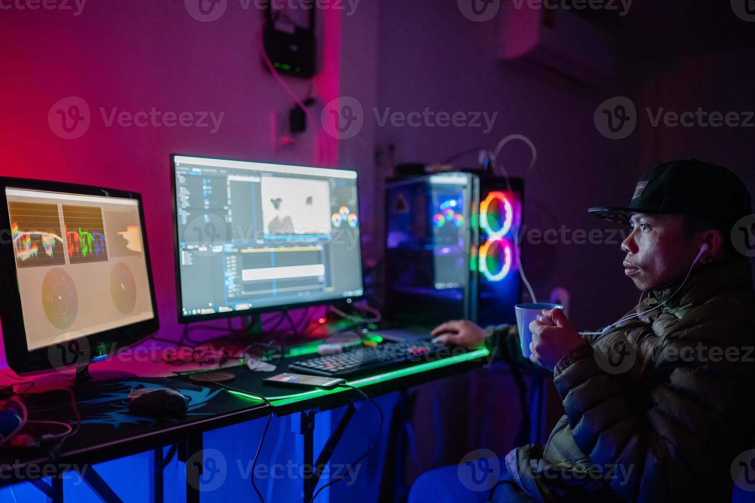 Editor man video editing and color list grading and enjoying with coffee in the house studio this is lifestyles of freelancer photo
