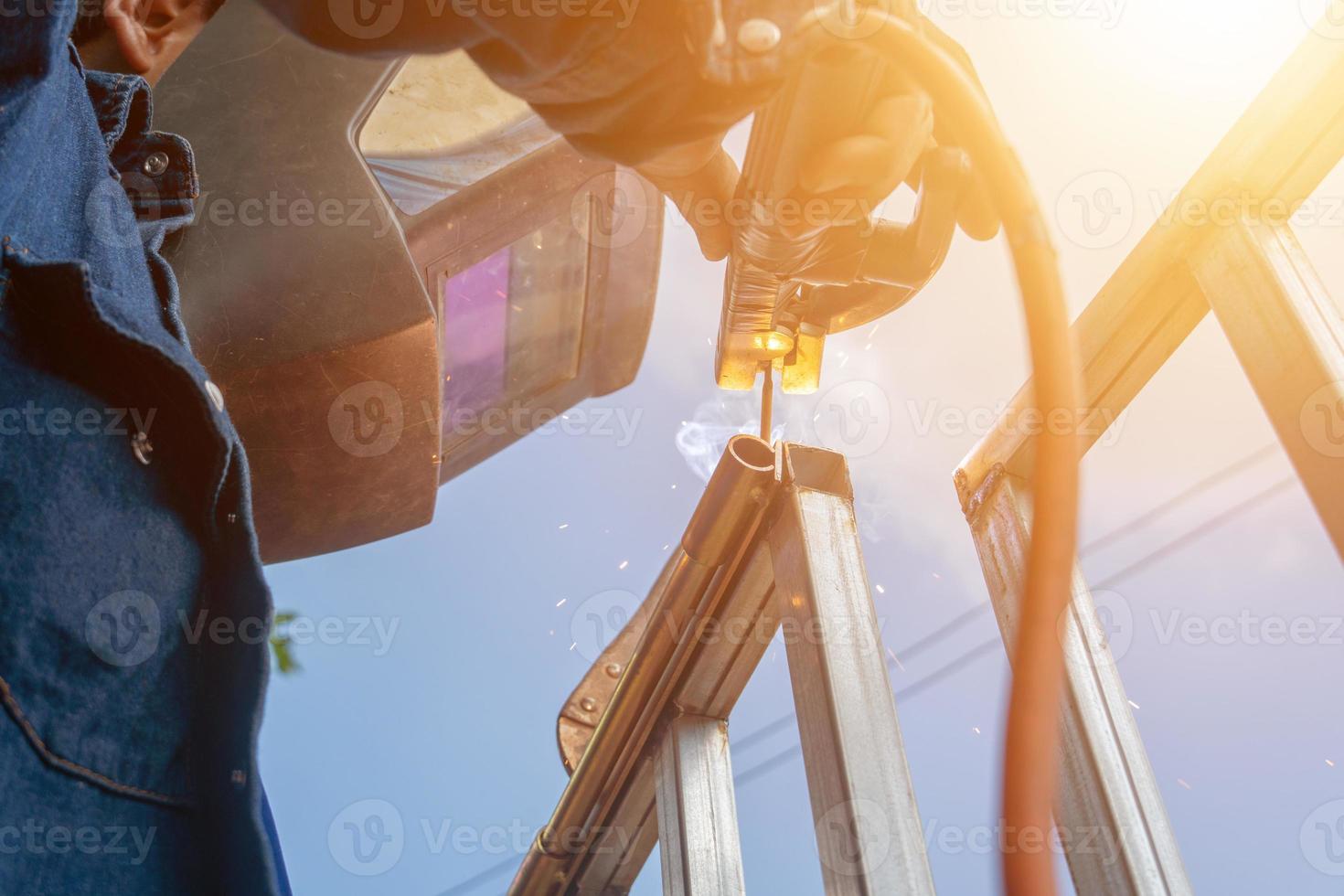 Angle shot welder is building DIY ironwork. photo