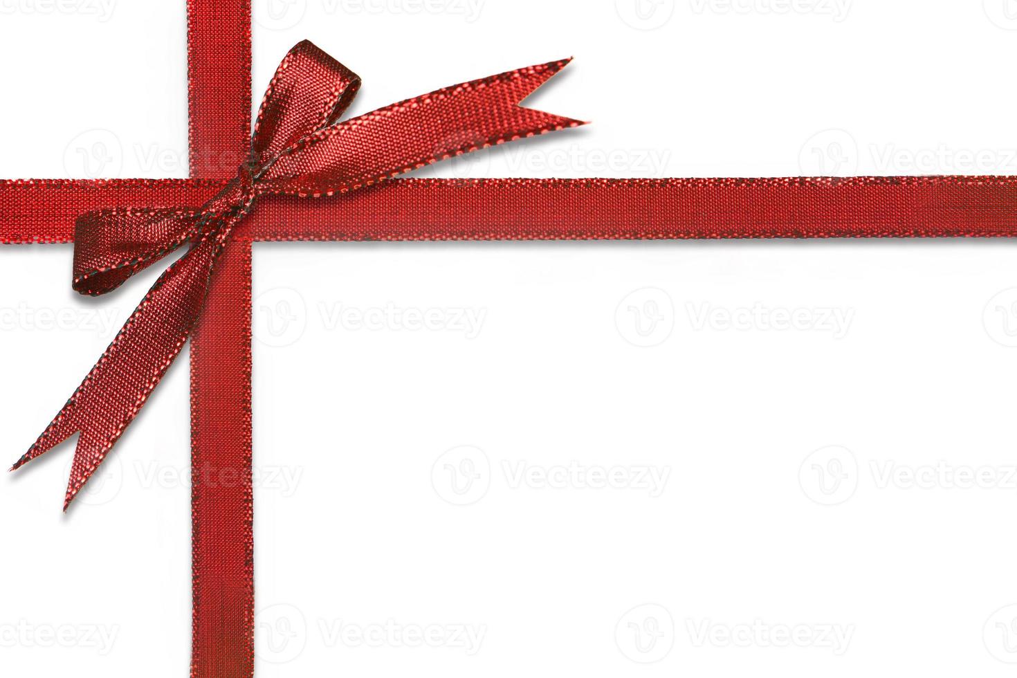 Christmas Gift Wrapped in Pretty Red Bow photo