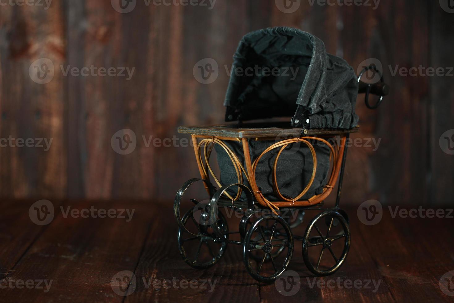 Baby Cradle on Grunge Wooden Background photo