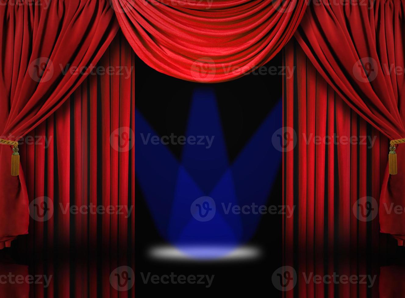 Velvet Theater Stage Drape Curtains With Blue Spotlights photo