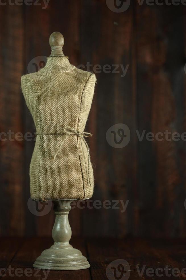 Antique Mannequin Busts on Wood Grunge Background photo