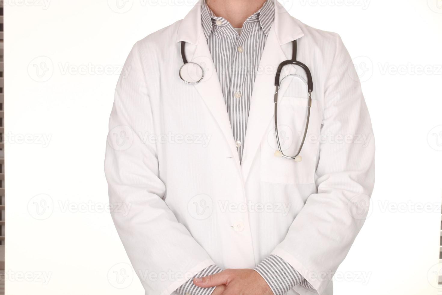 Male Doctor Wearing Stethoscope on White Background photo