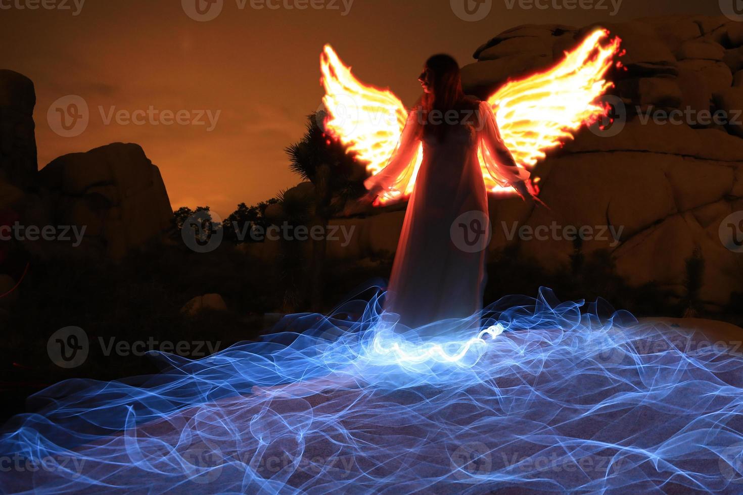 Person Light Painted in the Desert Under the Night Sky photo