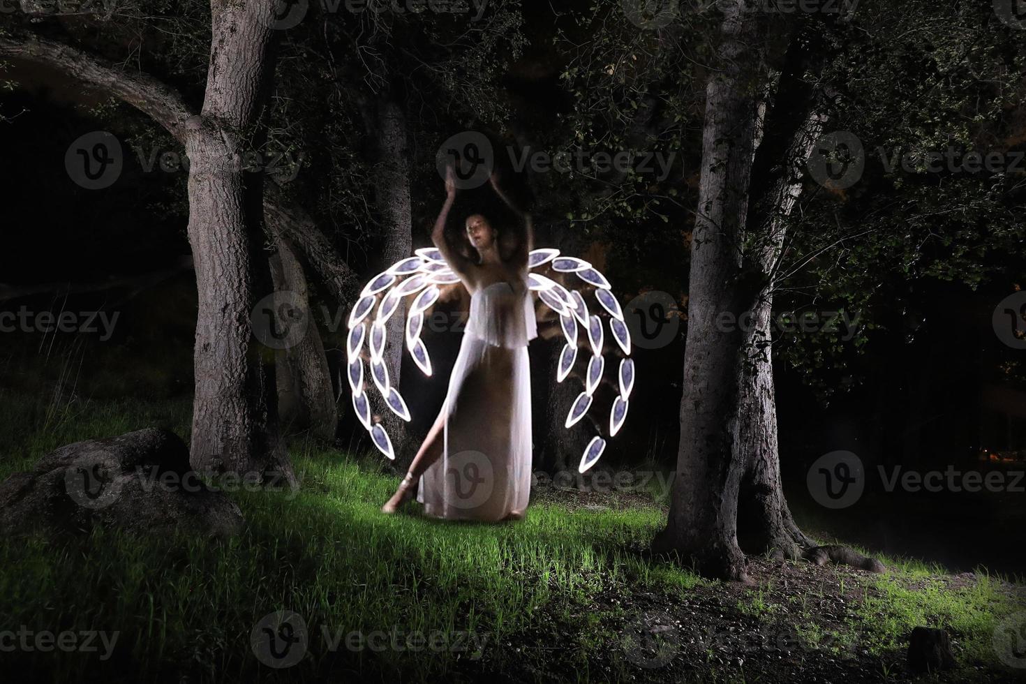 Girl Light Painted in the Desert Under the Night Sky photo