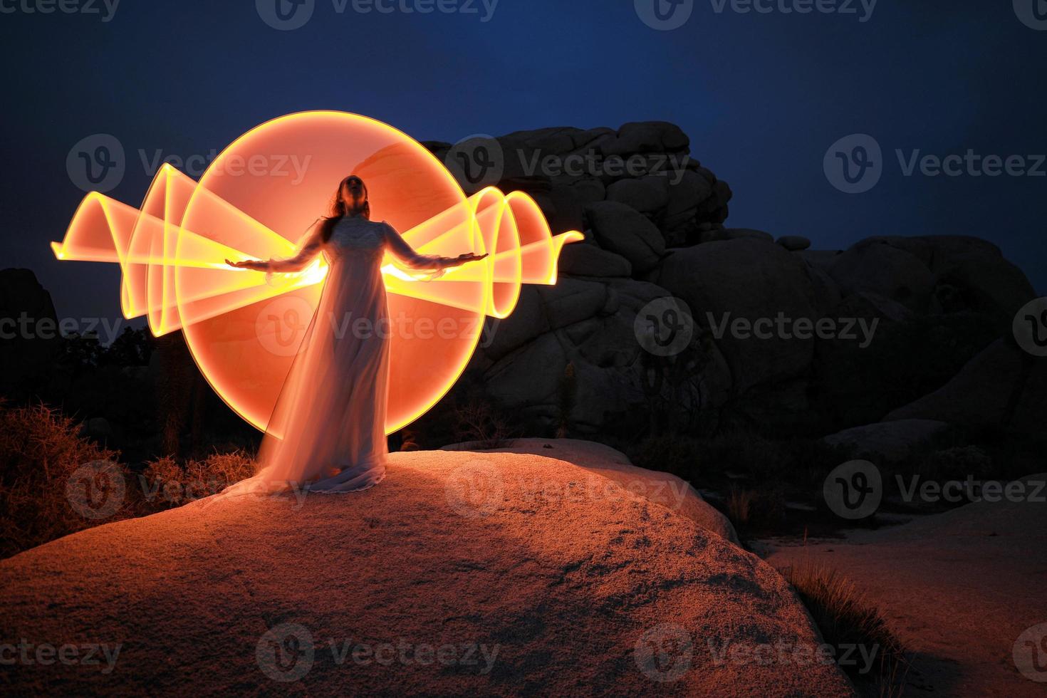 Person Light Painted in the Desert Under the Night Sky photo