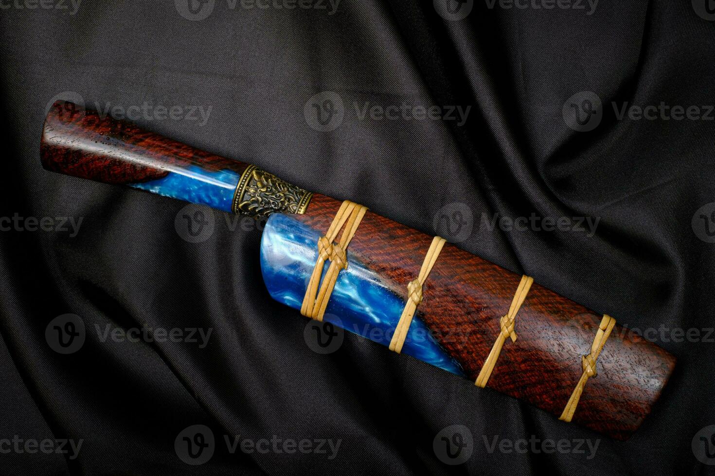 knife custom or Enep in the natural wood scabbard on old table background handmade of Thailand photo