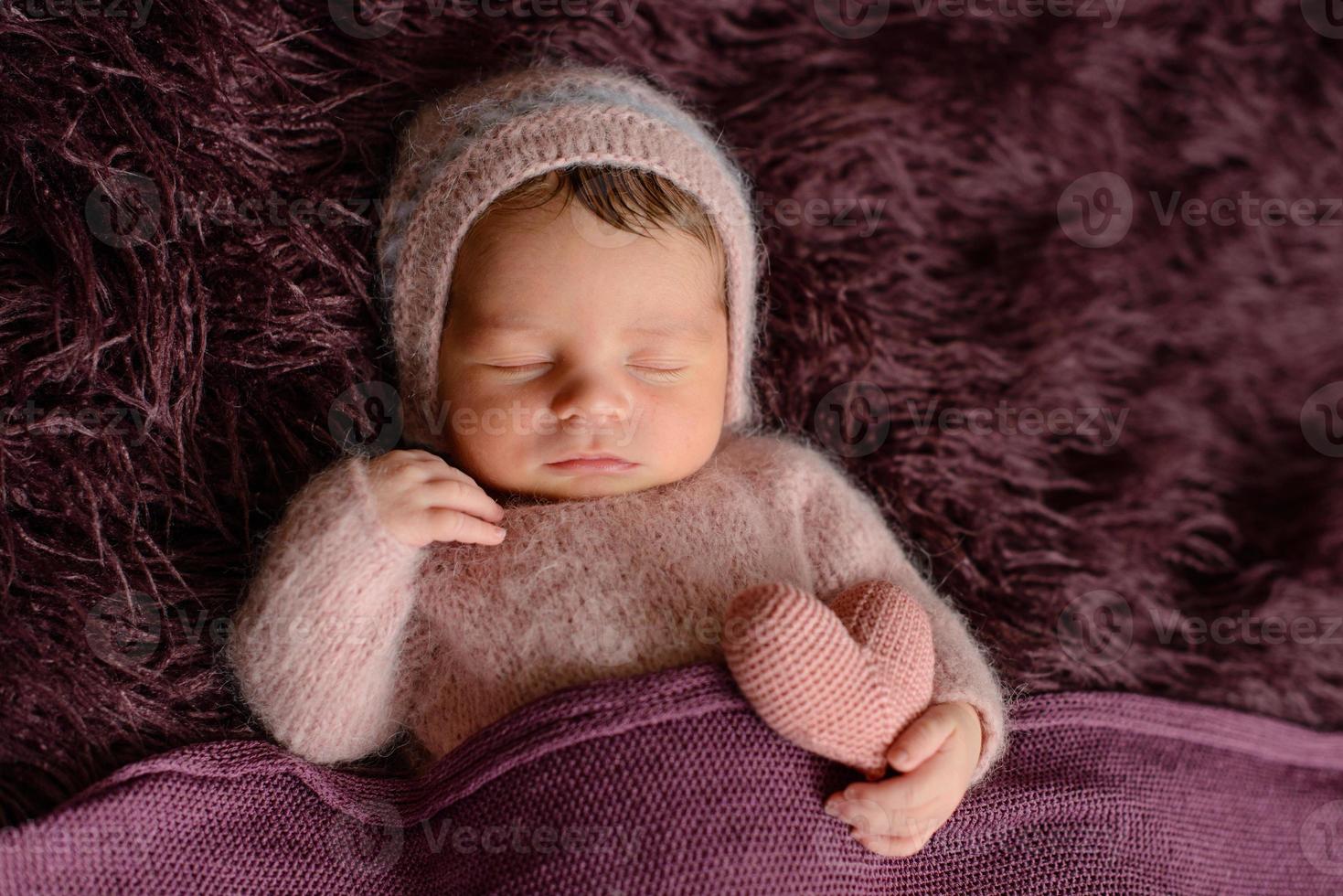 A little newborn girl eight days old. Close-up beautiful sleeping baby girl photo