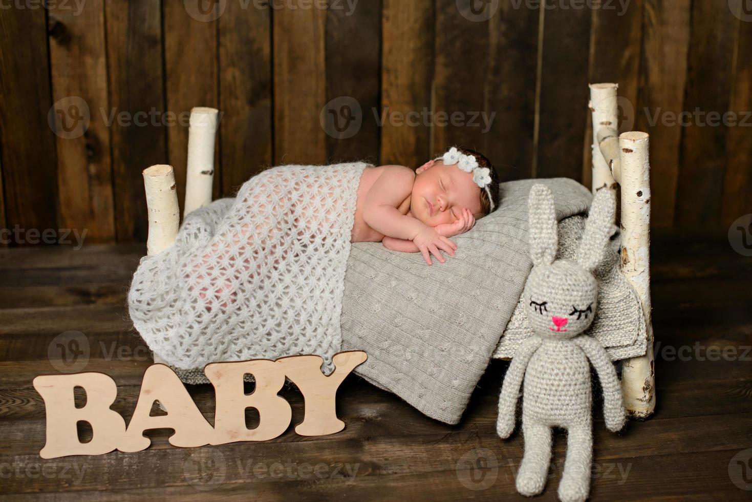 A little newborn girl eight days old. Close-up beautiful sleeping baby girl photo