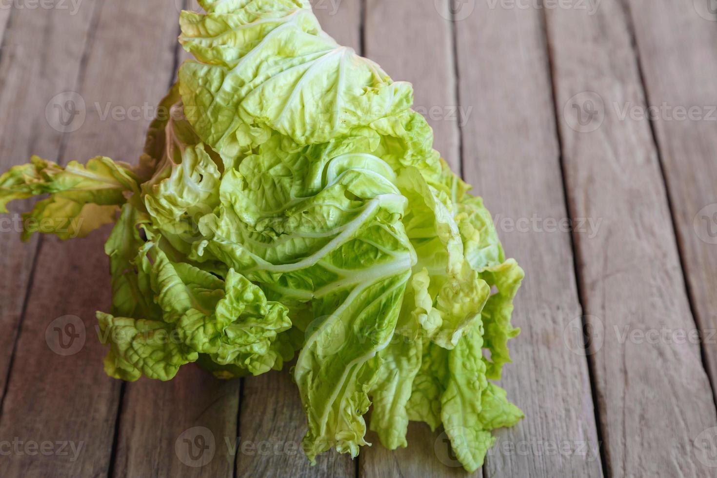 White cabbage on wooden table photo