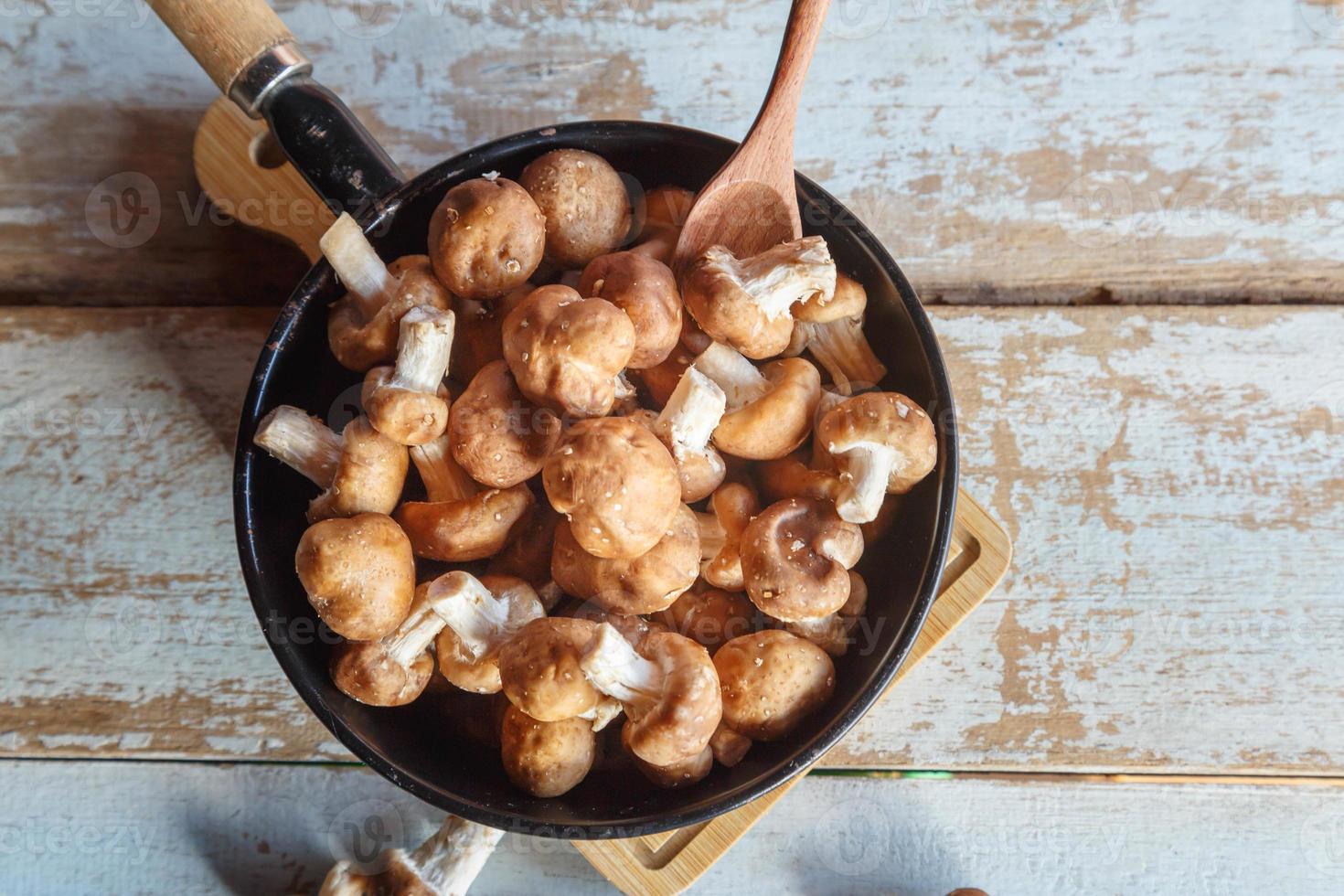 Fresh shiitake mushrooms in a pan for cooking photo