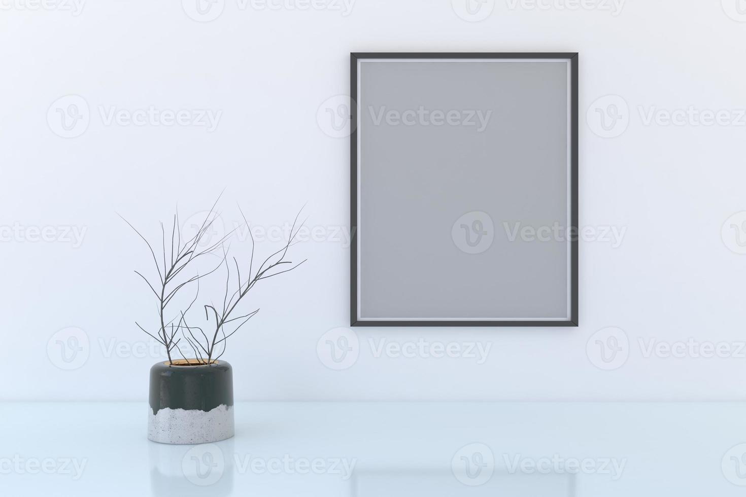 Blank frame with decorative plant vase on floor photo