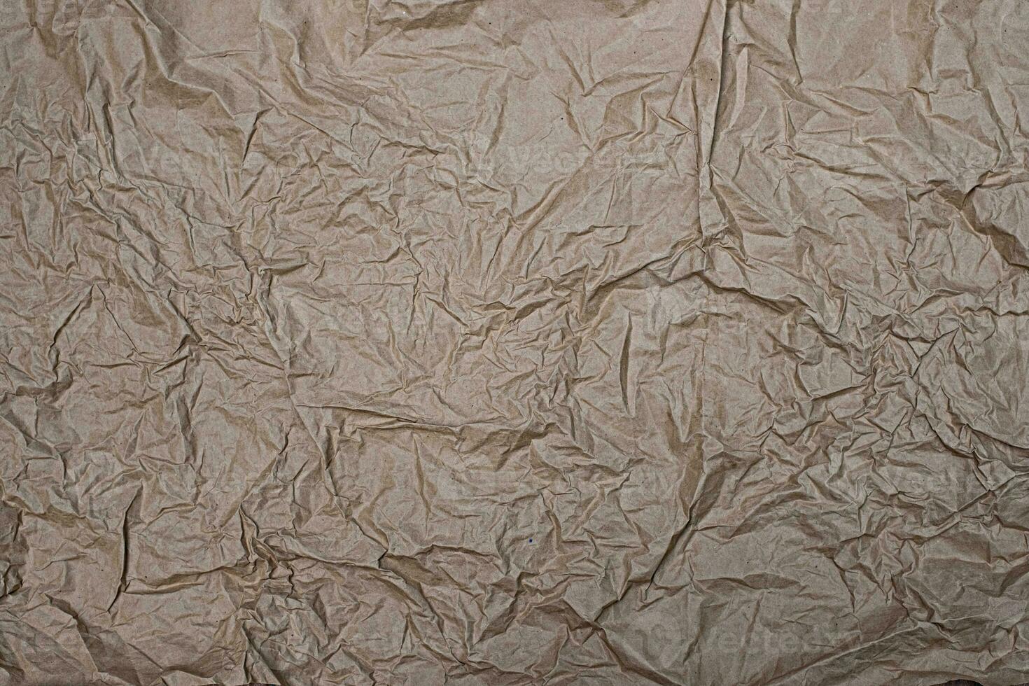 Close up crumpled creased paper old texture background photo