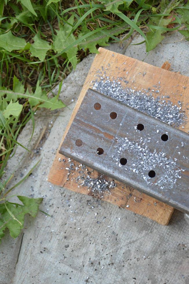 Making holes by drilling metal photo