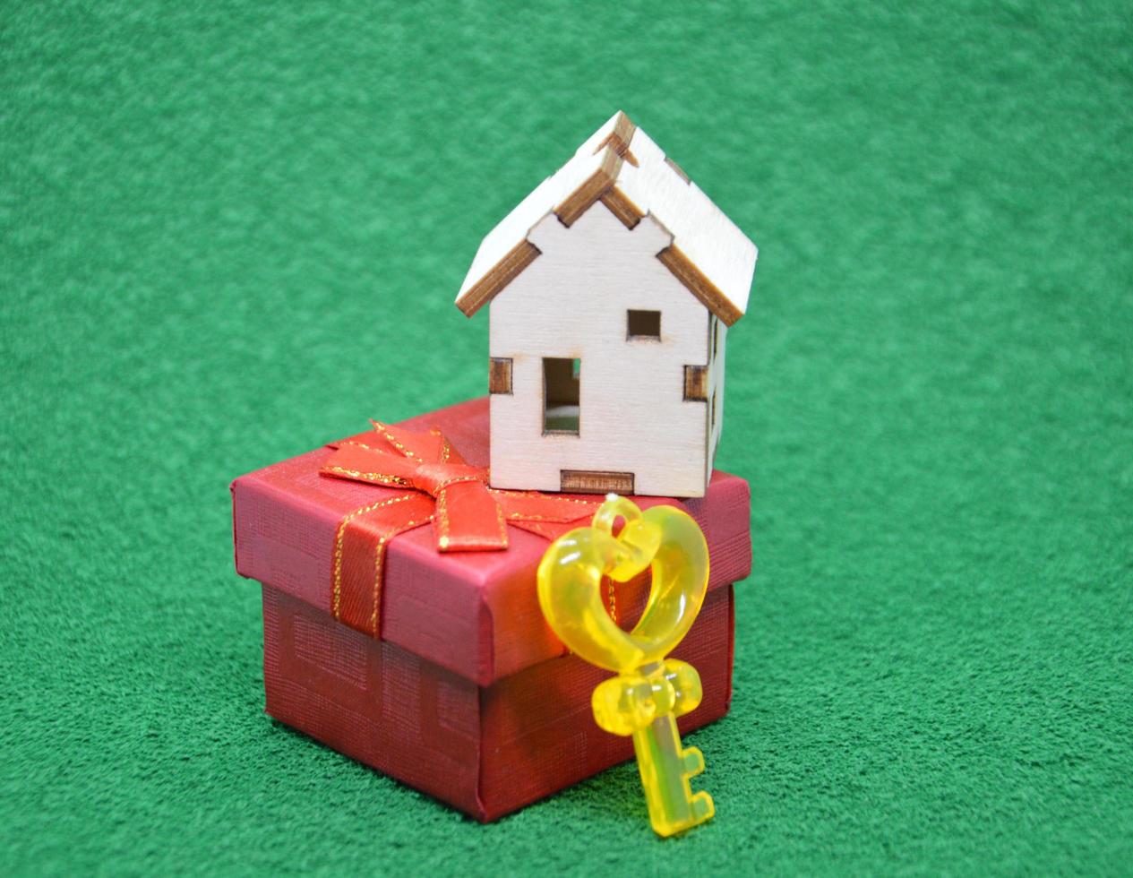 Receiving keys to his apartment building on a background of green grass photo