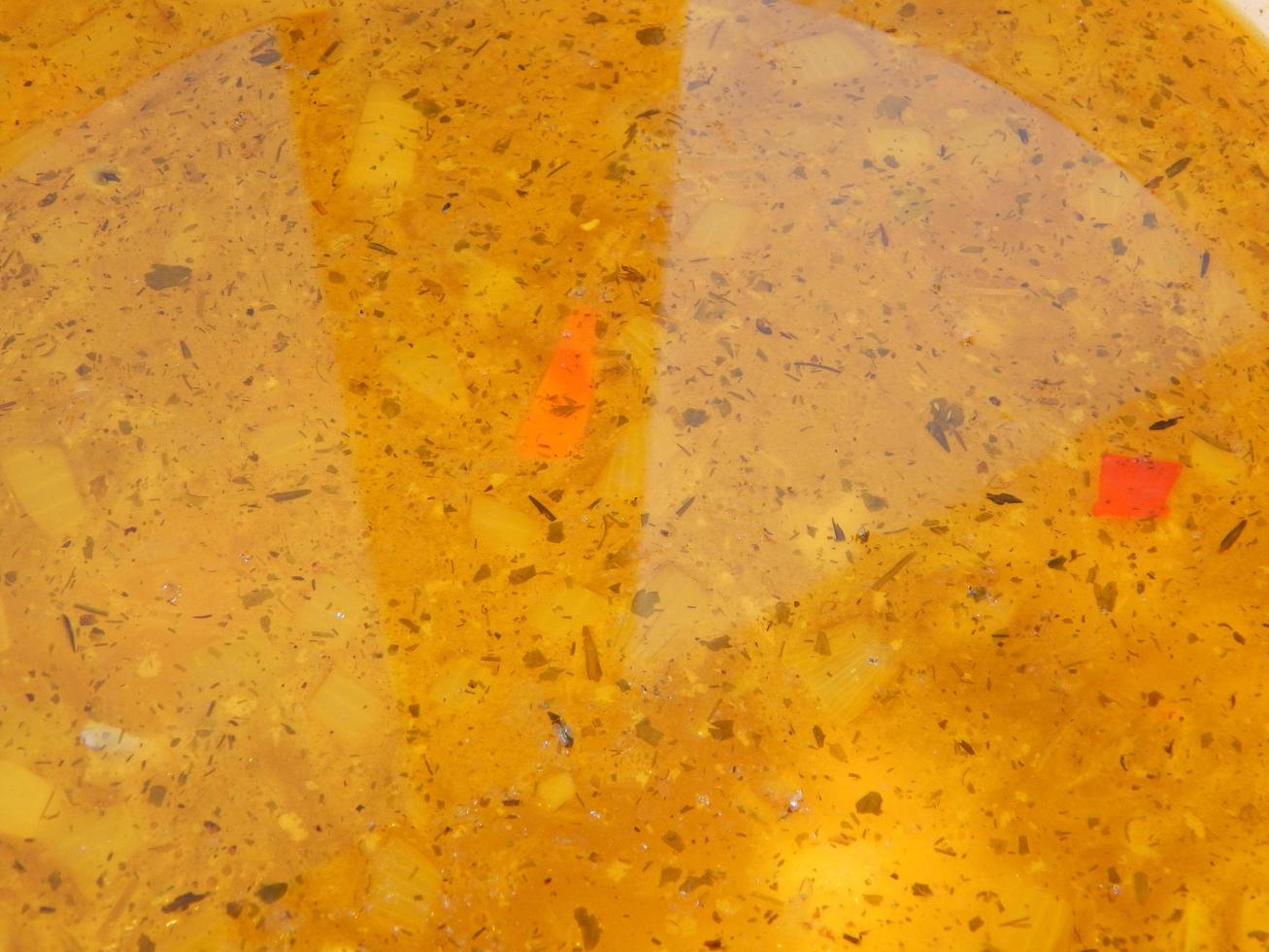 Vegetable soup with meat textured in a pan photo