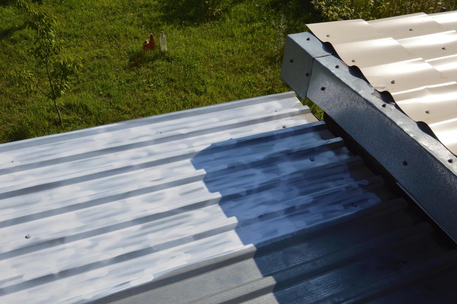 Roof painting with enamel paint from an aerosol can photo