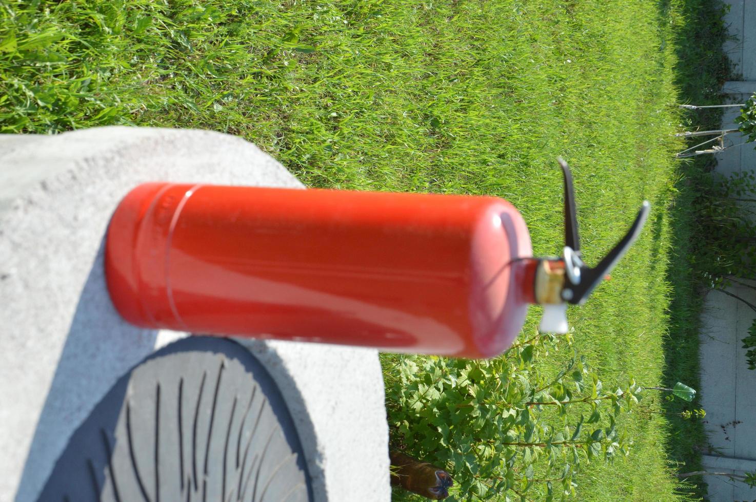 Handheld fire extinguisher to protect home and interior from fire photo