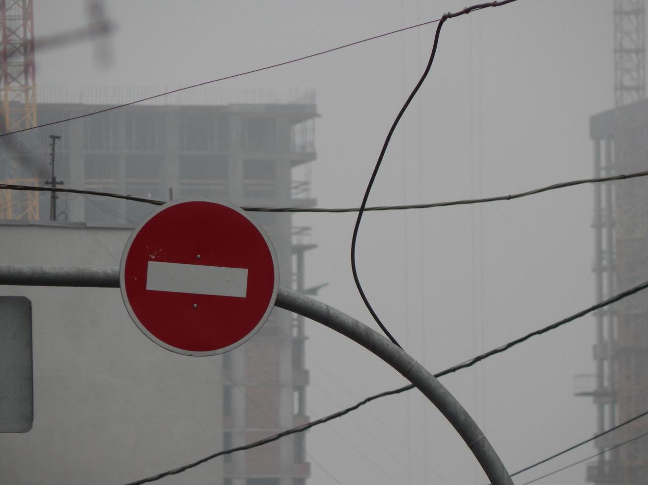 Road signs indicating the direction of movement of cars and pedestrians photo