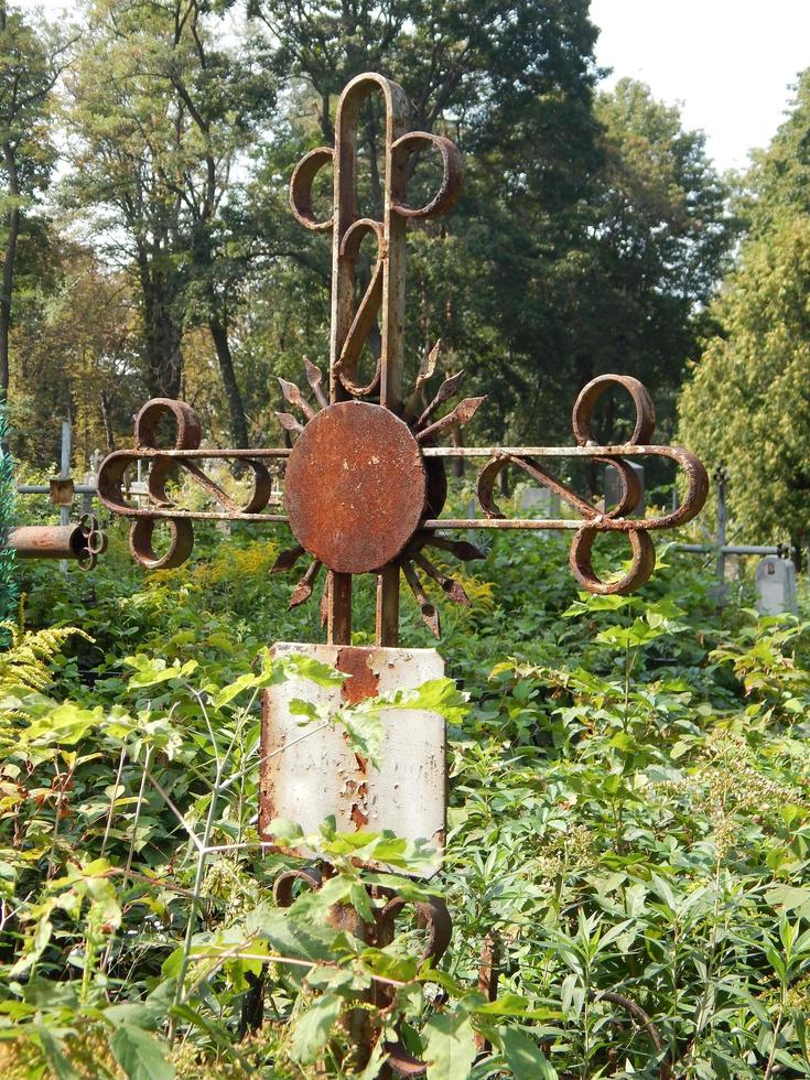 Crosses on graves cemetery and fences photo