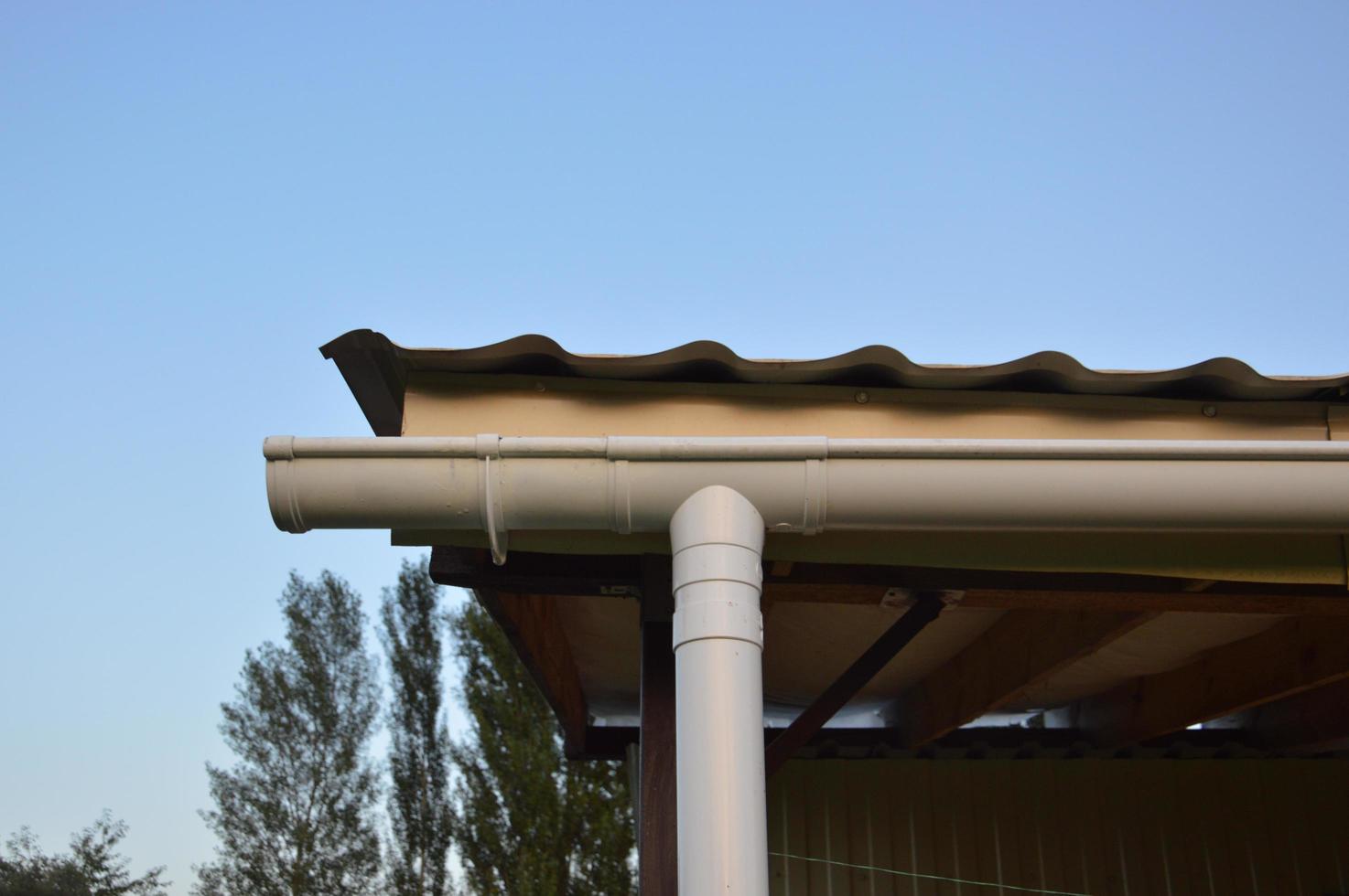 Drainage system fixed on the canopy of the house photo