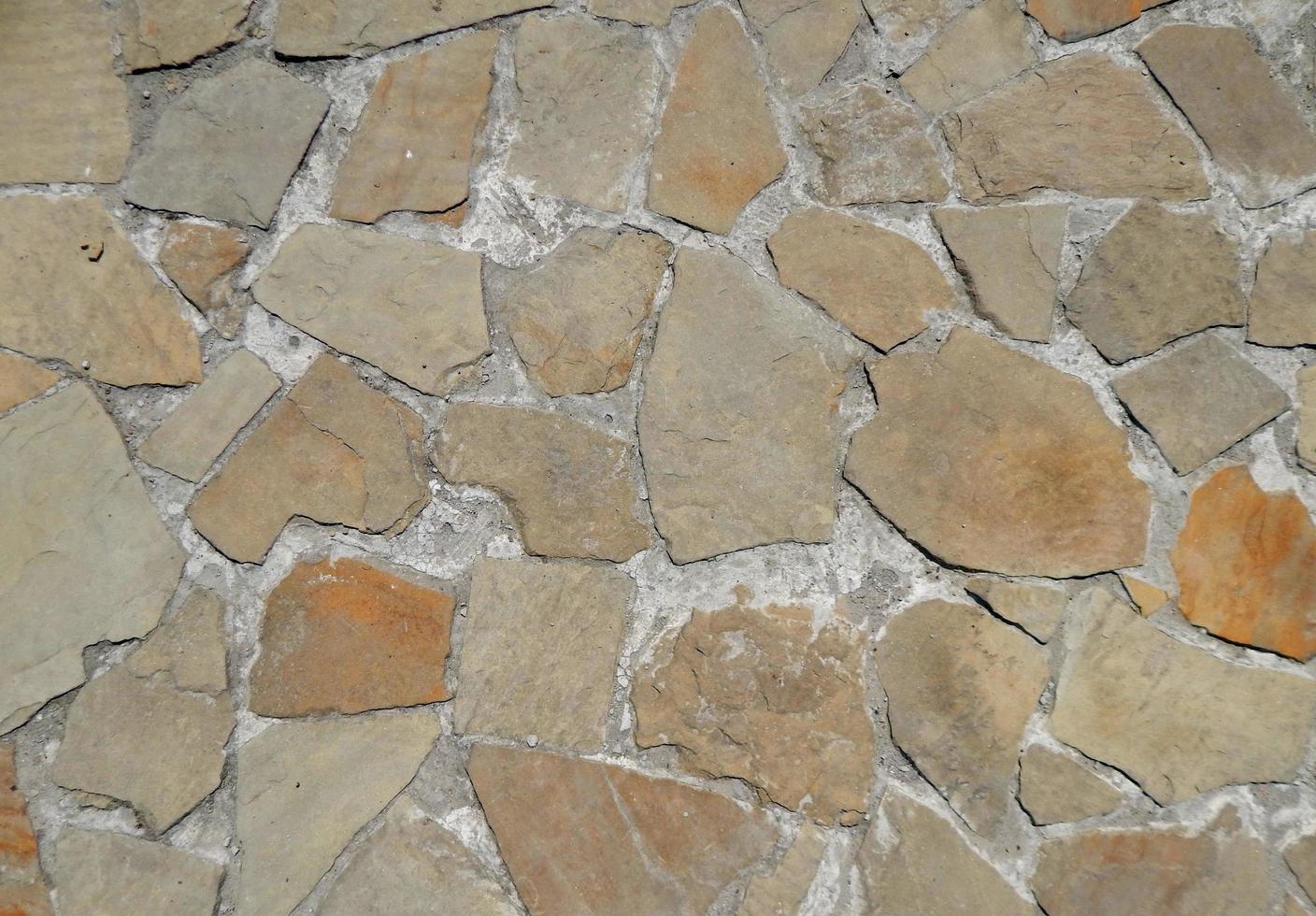 Texture of natural stone material and brick masonry walls photo