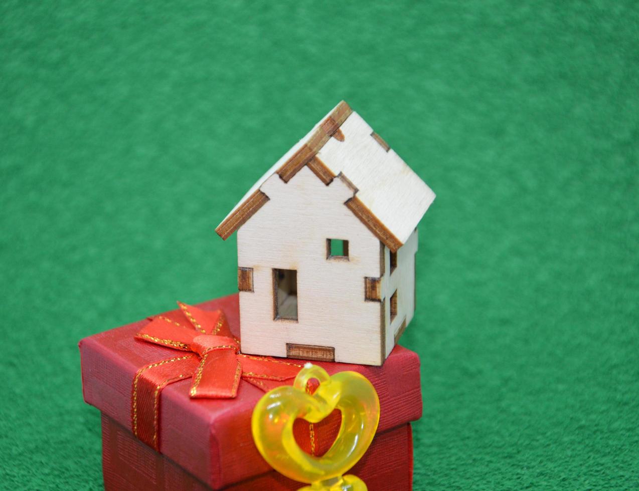 Receiving keys to his apartment building on a background of green grass photo