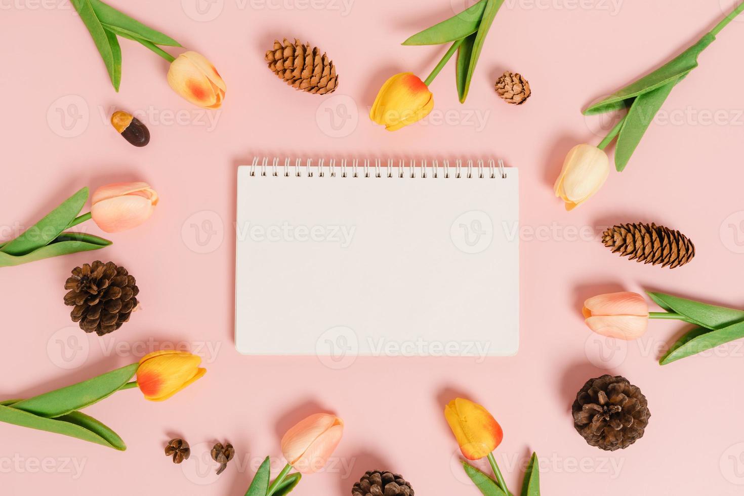 Creative flat lay of travel vacation spring or summer tropical fashion. Top view beach accessories open mockup black notebook for text on pastel background. Top view mock up copy space photography. photo